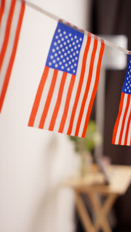 Vertical-Video-Close-Up-Of-American-Stars-And-Stripes-Flag-Bunting-For-Party-Celebrating-4th-July-Independence-Day-4